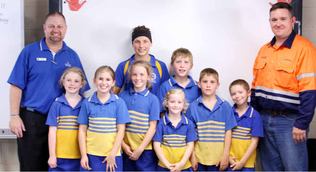 Anglo American supported Middlemount Community School’s technology overhaul by donating $65,000 to purchase electronic whiteboards for every primary classroom. Business services central region manager Dale Cook is pictured with school principal Rob Slater and students. Anglo American supported Middlemount Community School’s technology overhaul by donating $65,000 to purchase electronic whiteboards for every primary classroom. Business services central region manager Dale Cook is pictured with school principal Rob Slater and students.
